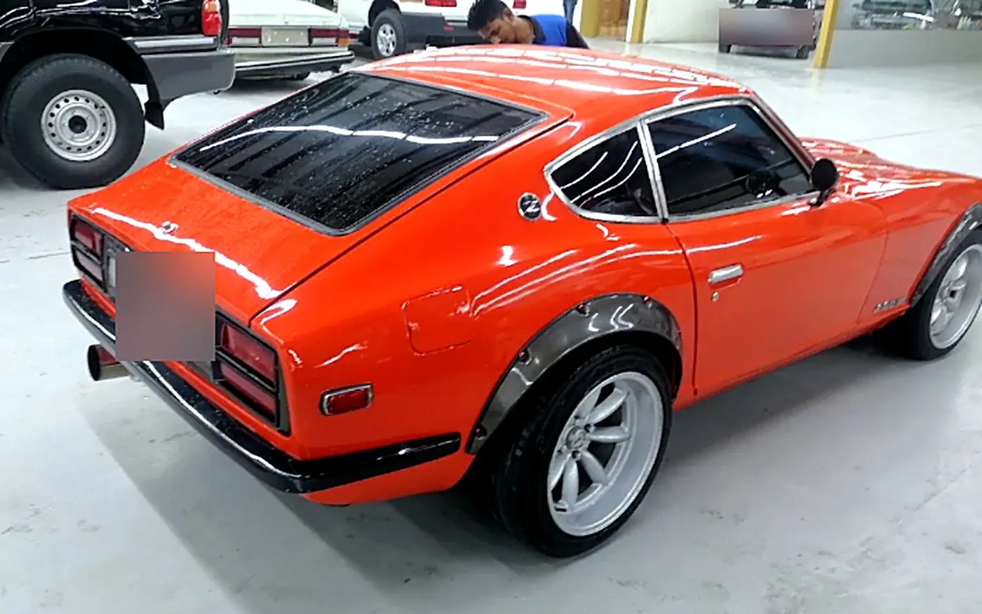 Orange Datsun 240Z after paint and polish
