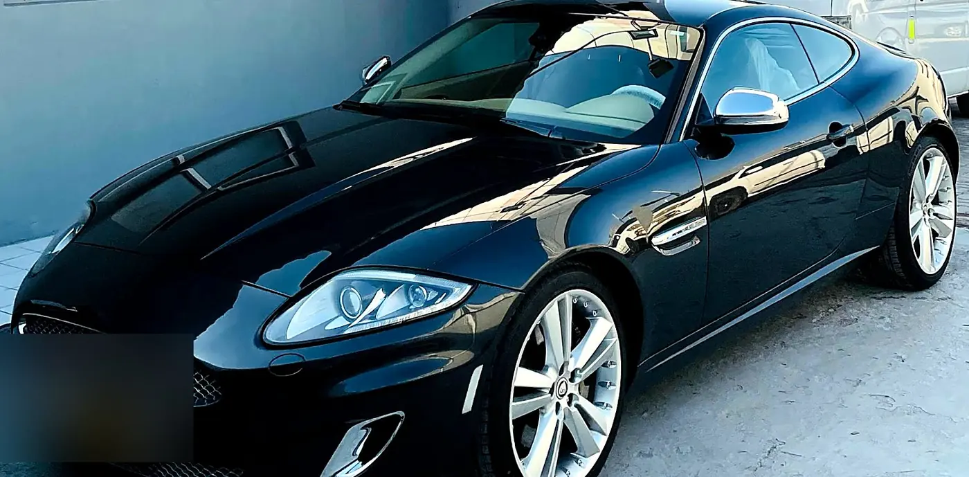Black Jaguar XKR after front-end repair and repaint at M19