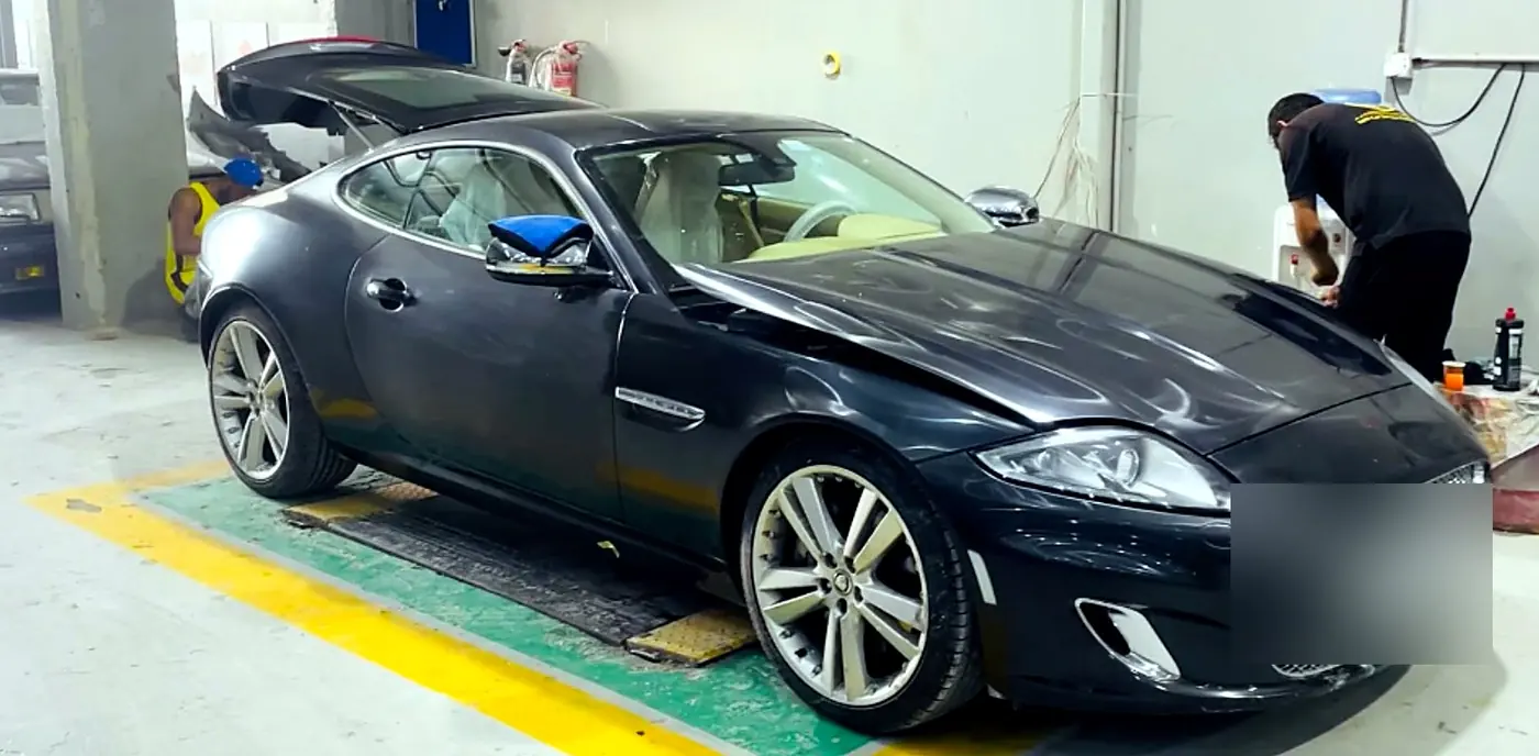 Jaguar XKR arriving at M19 with front-end damage